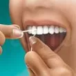 روش-صحیح-نخ-دندان-کشیدن